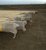 New burlap bags at the pipe end