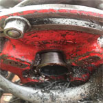 Close up on the machine threading a pipe