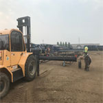 Pipes are loaded on the rack where they will thread